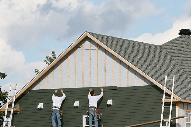 Professional Siding technician working in Hempstead, NY